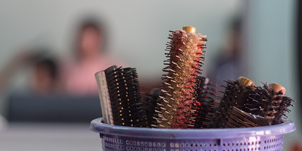 Close up of combs in basket at salon with blur background.